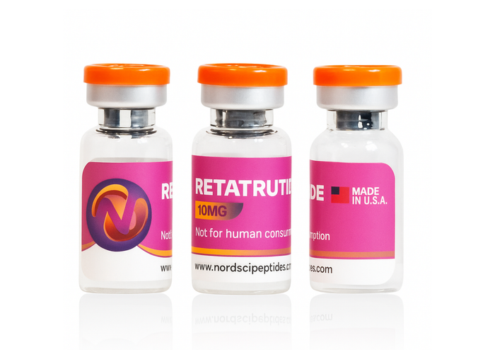 Three vials with pink labels and orange caps on a white background